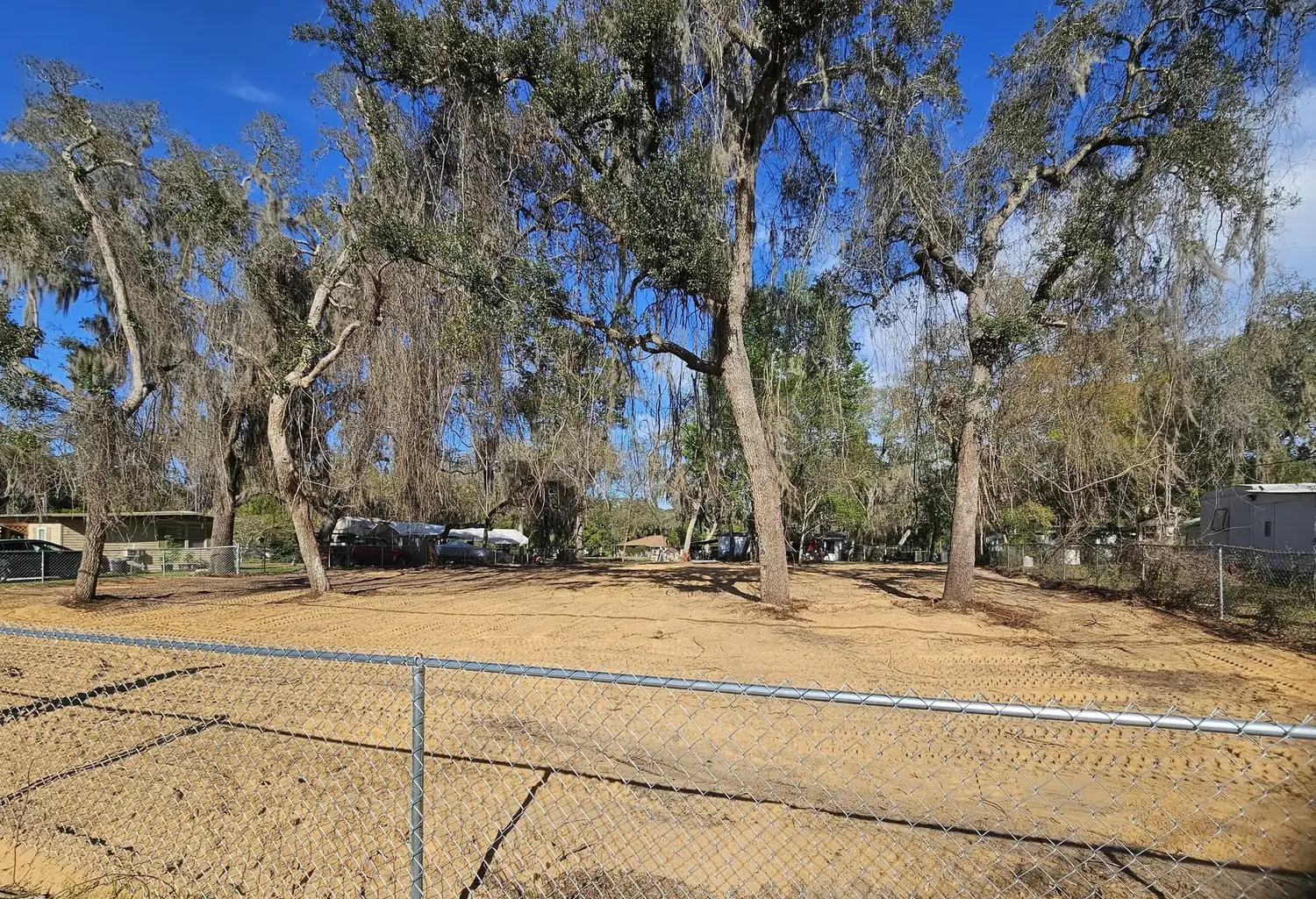 Cleared and graded Ocala property with live oaks preserved, ready for pasture or arena work